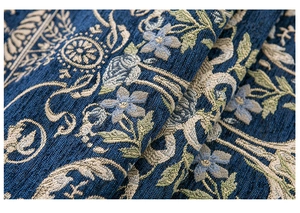 Detailed close-up of European floral jacquard chenille fabric with intricate texture