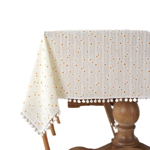 Floral yellow daisy cotton jacquard tablecloth with decorative white fringe pom-poms