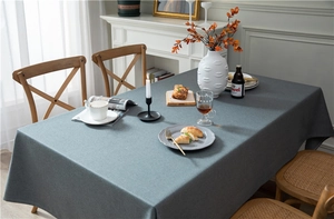Detail of dark blue faux linen tablecloth showing thick texture and natural drape