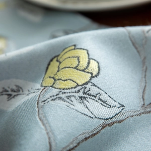 Modern light blue table runner with yellow rose floral embroidery and fringe