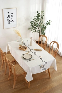 Detail of embroidered floral tablecloth with You Are My Sunshine cursive lettering