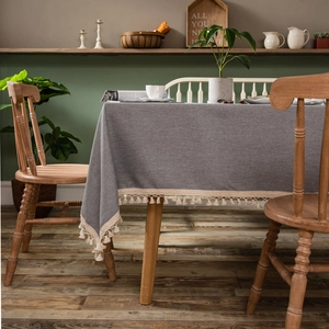 Modern dark gray tablecloth with elegant cream fringe edges for rectangular dining tables