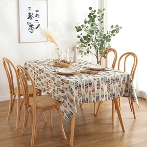 Bohemian rectangular tablecloth with colorful feather print in a cozy dining setting