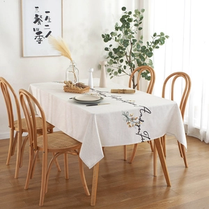 Beige cotton linen tablecloth with floral embroidery and elegant black cursive lettering