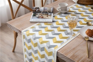 Detailed texture of jacquard chenille table runner with yellow grey chevron pattern