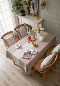 Detailed view of bohemian jacquard tablecloth featuring wave tassels and geometric textures