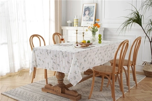 Macro detail of pastoral floral cotton tablecloth with lilac and jacquard patterns