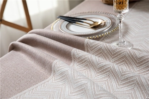 Detailed close-up of premium jacquard fabric with elegant tassel edge and wave pattern
