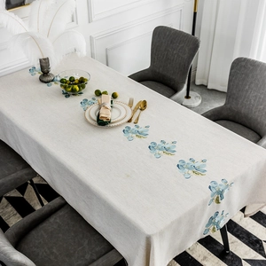 Elegant rectangular beige linen tablecloth with blue floral embroidery for dining table