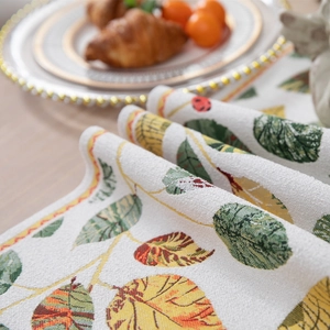 Chenille table runner with jacquard leaf pattern and tassels for home dining decor