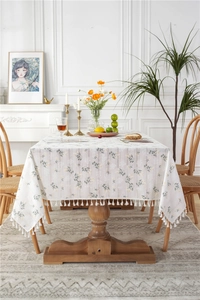 Detailed view of floral pattern and white tassel fringe on the cotton jacquard tablecloth