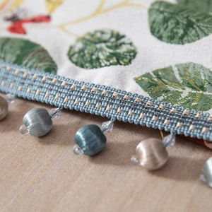 Chenille table runner with leaf embroidery, insect patterns and silk tassel fringe detail
