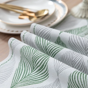 Modern jacquard leaf chenille table runner with tassels and thick textured fabric