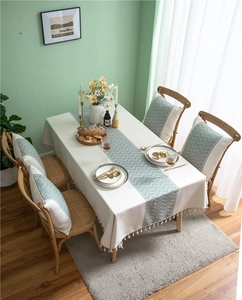 Close-up of jacquard wave pattern and elegant tassel fringe on polyester table linen