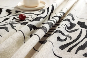 Detailed close-up of tiger stripe pattern tablecloth fabric with high fiber texture