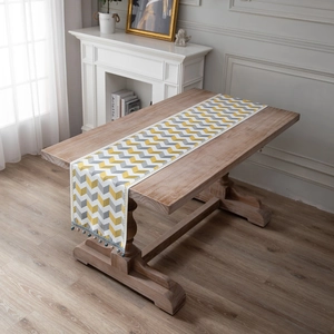 Modern jacquard chenille table runner with yellow and grey wave patterns and tassels