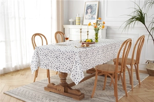 Close-up of cotton floral jacquard fabric with sunflower pattern on a wooden dining table