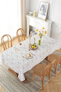Close-up of cotton jacquard fabric with sunflower pattern and delicate texture on a table