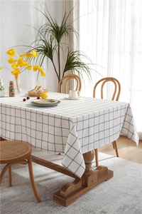 Detail of minimalist black and white checkered tablecloth with a cotton-linen texture