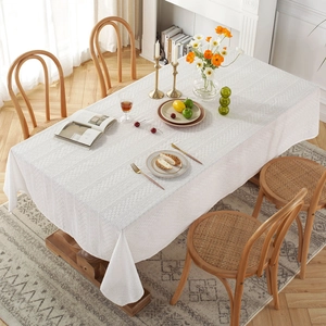 White French country lace tablecloth with hollow embroidery on a wooden dining table
