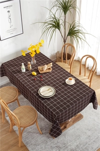 Detailed view of dark brown checkered tablecloth texture with fine white grid lines