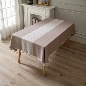 Rectangle tablecloth with chevron pattern and wave tassel edges on a coffee table