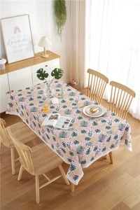 Detailed close-up of a floral tablecloth with lace edges in a modern home setting