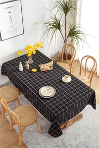Close-up of black and white grid tablecloth with elegant cotton-polyester fabric texture