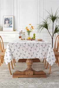 Macro view of floral pattern cotton jacquard tablecloth in a bright modern dining room