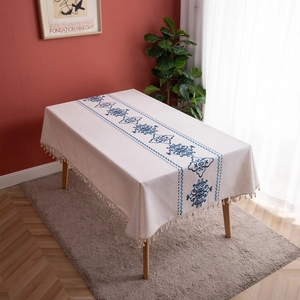 Bohemian beige tablecloth with blue embroidery pattern and decorative tassel edges
