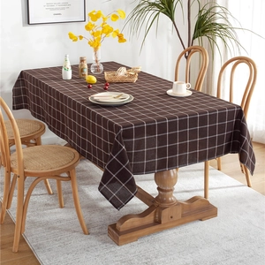 Brown and white checkered cotton linen rectangular tablecloth in a cozy home setting
