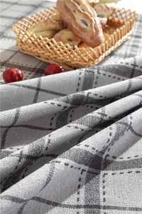 Detail of grey grid linen tablecloth fabric texture with rustic table setting