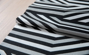 Macro detail of geometric chenille jacquard fabric with modern zigzag pattern