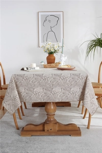 Detail of waterproof tablecloth showing nature-inspired leaf prints and jacquard texture