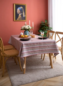 Detailed close-up of Bohemian floral pattern fabric with elegant white woven tassels