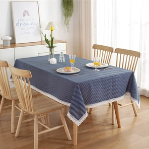 Navy blue polka dot tablecloth with elegant white lace border for rectangular dining table