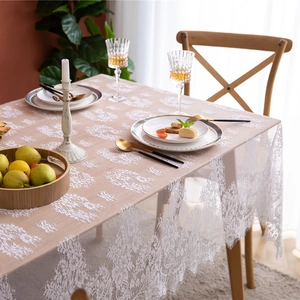 White lace tablecloth with floral patterns and eyelash edges for rustic wedding decor
