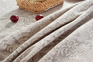 Detail of waterproof pastoral floral tablecloth with leaf and feather patterns