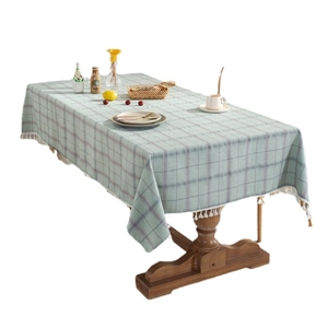 Green and grey plaid linen tablecloth with elegant white tassels for dining room tables