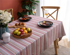 Close-up of Bohemian floral striped tablecloth with decorative cream-colored tassels