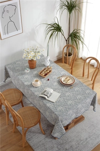 Detail of vintage blue floral tablecloth with high-density printing and stitched edges