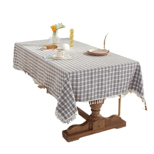 Rectangular grey and white plaid tablecloth with elegant white fringe tassel edges