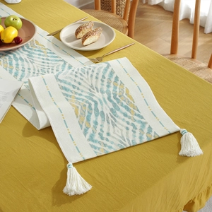 Modern Nordic table runner with blue and yellow geometric patterns and white fringe tassels