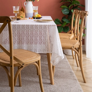 French country style white lace tablecloth with vintage floral pattern on a wooden dining table