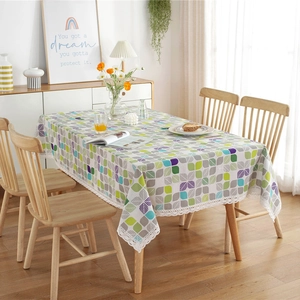 Rectangular polyester-cotton tablecloth with colorful leaf pattern and white lace trim