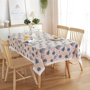 Polycotton tablecloth with tropical leaf pattern and white lace edge in Nordic style