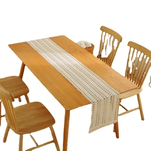 Bohemian cream woven table runner with hollow texture and elegant fringe tassels