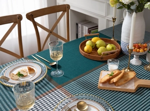 Detail of green and white checkered tablecloth featuring premium woven fabric texture