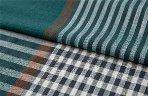 Macro view of geometric jacquard tablecloth fabric with stripe and check patterns