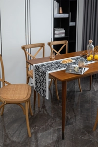 Close-up of black and white jacquard table runner with modern English letter typography